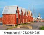 Old fishermen cottages in port of Faaborg in Denmark on a sunny summer evening