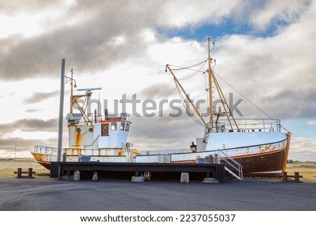 Old fishing boat as an attraction on the seaside of the Icelandic sea, Holmsvollur, Sudurnesjabaer, Iceland