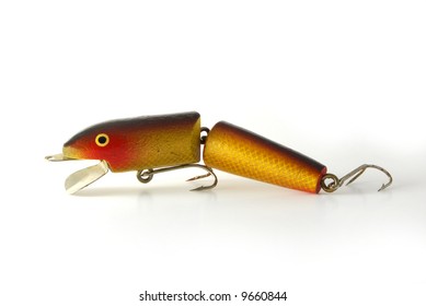 An Old Fishing Lure On A White Background