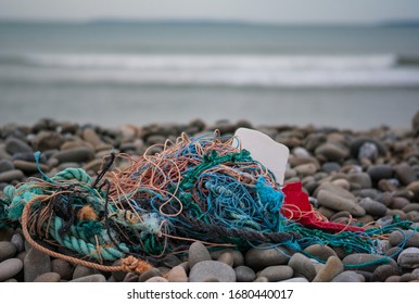 Old fishing nets and plastic waste washed up on the shore of the west coast of Ireland