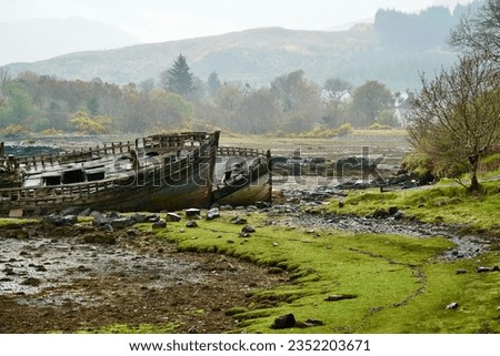 Old fishing ship wrecked with wilderness landscape
