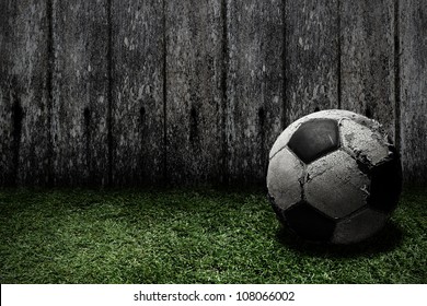 Old football on grass - Shutterstock ID 108066002