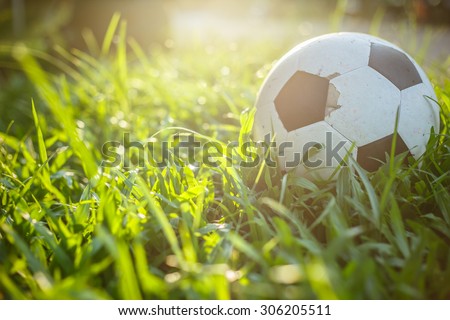 old football on the green