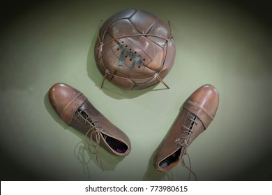 Old Football Shoes And Old Ball