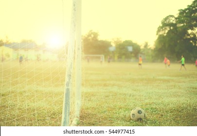 old football Vintage photography with soccer goal with lens flare effect