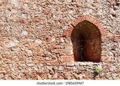 Old Fortress Red Brick Stone Wall With The Arch Window Close Up