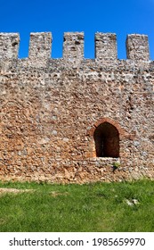 Old Fortress Red Brick Stone Wall With The Arch Window Close Up