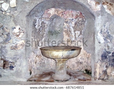 Old fountain bowl in the ancient city of Herculaneum, in Italy, destroyed in 79AD by the eruption of Mount Vesuvius