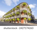 old french building with typical iron balconies in the french quarter in New Orleans, Louisiana, USA