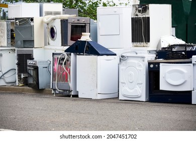Old fridges freezers wash machines and kitchen appliances at rubbish dump - Shutterstock ID 2047451702