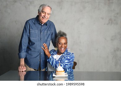 Old Friends Celebrating A Birthday With Cake