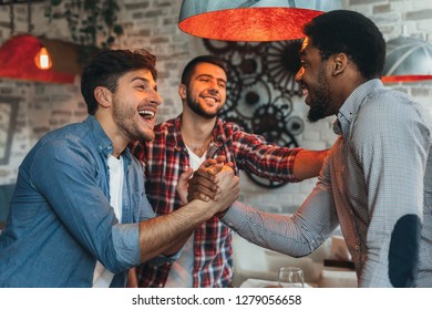 Old Friends Meeting. Three Friends Meet Each Other In Beer Pub