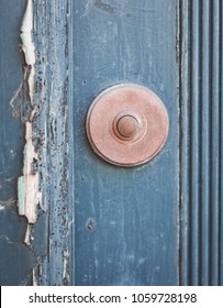 An Old Front Door Bell On A Wooden Wall