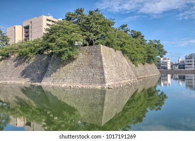 Old Fukui Castle Wall And Moat With Fukui Prefectural Office In 