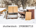 Old furniture for disposal under the snow. Old furniture dumped outside in winter