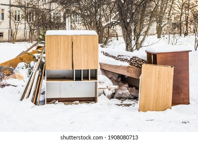 Old Furniture For Disposal Under The Snow. Old Furniture Dumped Outside In Winter