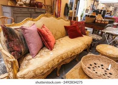 Old furniture sofa on antiques flea market in Arezzo Italy