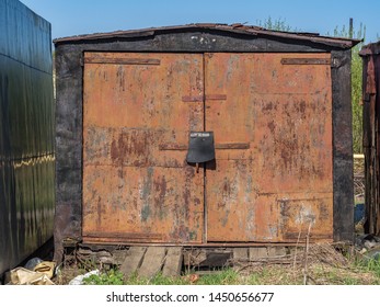 Old Garage Stands Alone In Summer