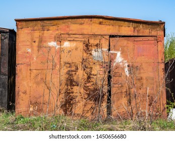 Old Garage Stands Alone In Summer