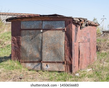 Old Garage Stands Alone In Summer