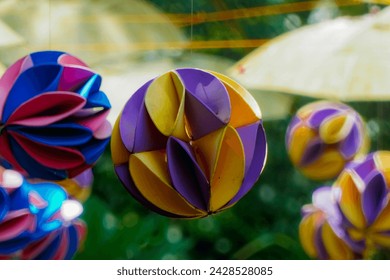 the old garden is decorated with hanging umbrellas and honeycomb paper ball - Powered by Shutterstock