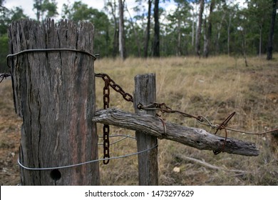 Old Gate With A Home Made Latch In A Barbed Wire Fence On A Cattle Grazing Property In Queensland, Australia.