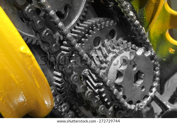 old gear and chain, machinery part
background ,Automotive transmission gearbox , internal combustion
engine of gears from old mechanism , factory
robot