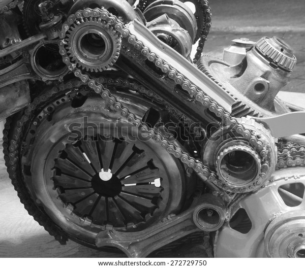 old gear and chain, machinery part\
background ,Automotive transmission gearbox , internal combustion\
engine of gears from old mechanism , factory\
robot