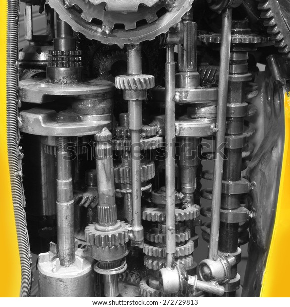 old gear and chain, machinery part\
background ,Automotive transmission gearbox , internal combustion\
engine of gears from old mechanism , factory\
robot