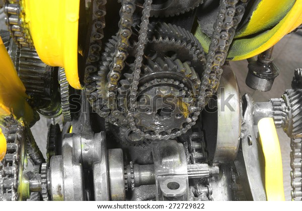 old gear and chain, machinery part background\
,Automotive transmission gearbox , internal combustion engine of\
gears from old mechanism ,\
factory