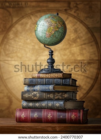 Old geographical globe and old book on map background. Science, education, travel background. History and geography team. Ancience, antique globe on the background of books.