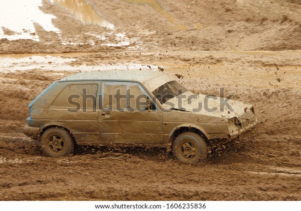 Old German front wheel drive dirty\
racing car on off road race, auto cross\
competition