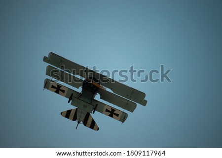 Old German Triplane Flying Past at an Airshow