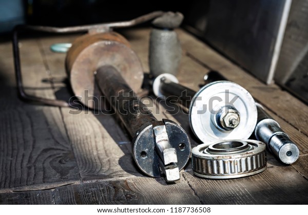 Old Gimbal bearing pulley. Car engine part reparing ,\
concept of modern vehicle motor and cut metal car and boat engine\
part details 