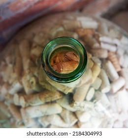 Old glass bottle full of used corks, view from above