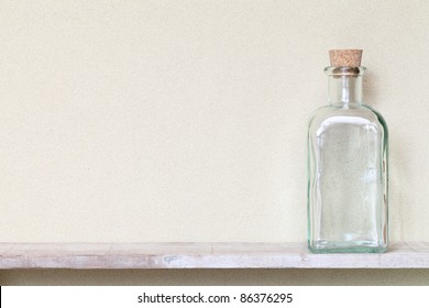 Old Glass Bottle On A Shelf