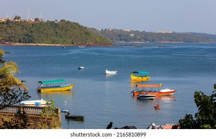 OLD GOA, INDIA - JANUARY 03, 2019: Colorful fishermen boats in Arabian sea near Old Goa in India.