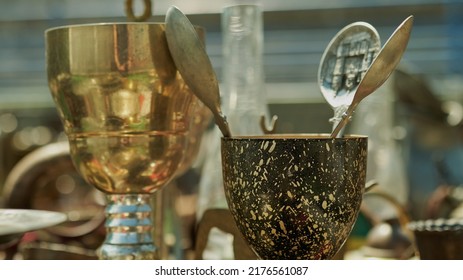 Old Goblet With Three Tablespoons Inside