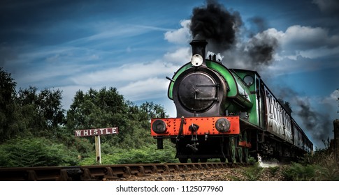 Old but gold - a steam train thunders down the track 
