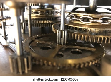 Old Grandfather Clock Workings. Cogs, Shafts, Gears & Chains, Close Up Workings And Mechanisms Inside. Engineering Of Time. Old 1900 Clock Gears Close Up During Clock Restoration.   