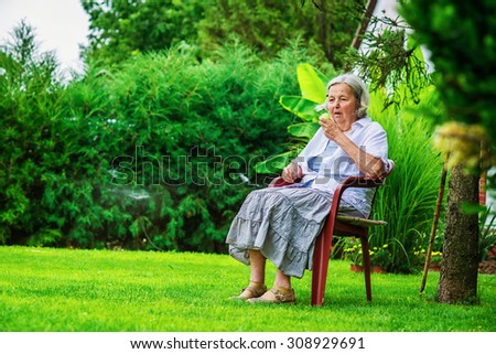 Similar – Senior woman in wheelchair