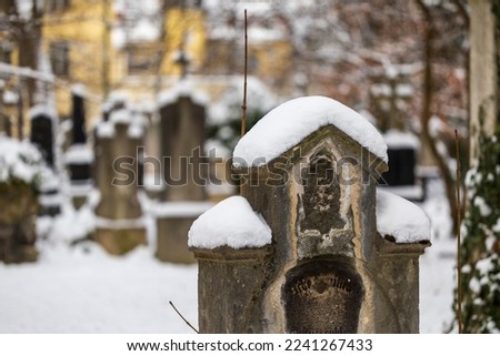 old grave yard covered in snow haunted and decaying