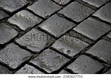 Old gray brick pattern with sun relfection