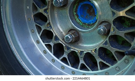 Old Gray Car Rims Have Worn Dirty With Lots Of Scratches And Paint Peeling Off.