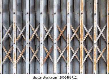 Old Gray Rolling Steel Door With Rust Pattern,close-up.