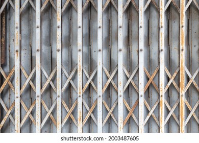 Old Gray Rolling Steel Door With Rust Pattern,close-up.