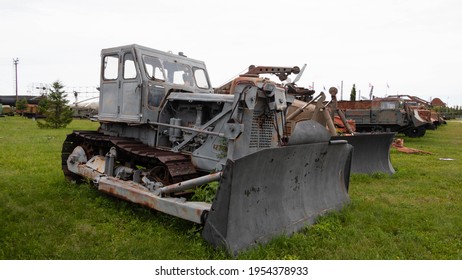 Old Gray Snow Plow Tractor