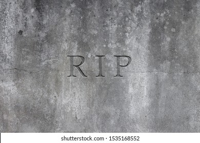 Old Gray Stone Headstone With Text R.I.P. Carved In It