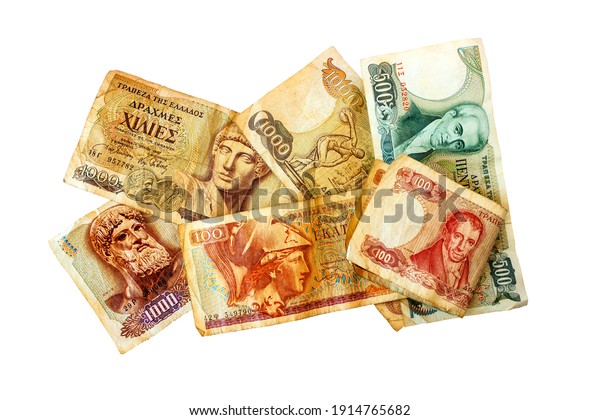 Old Greek money. Paper banknotes in denominations of 1000, one hundred and five hundred drachmas. Isolated on white.