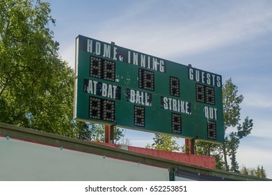 Old Green Baseball Scoreboard With Peeling Paint